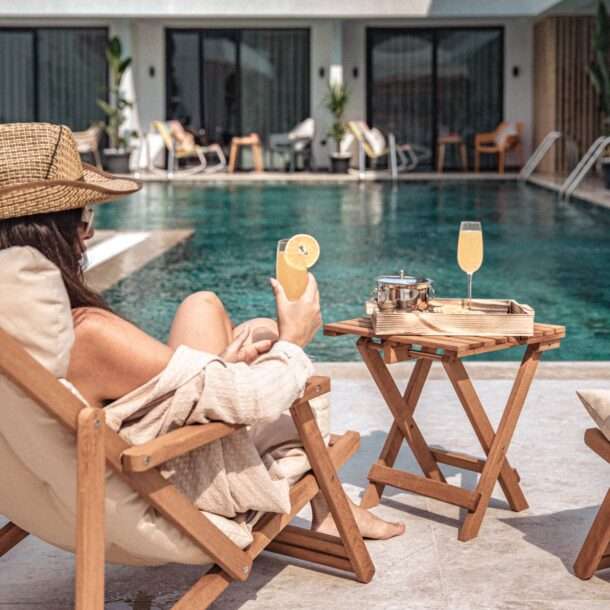 Scape Hotel Fethiye Outside woman with a drink looking at the pool