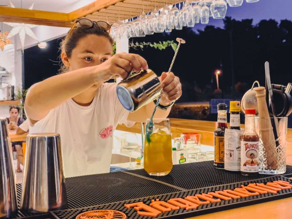 Scape Hotel bartender making cocktail