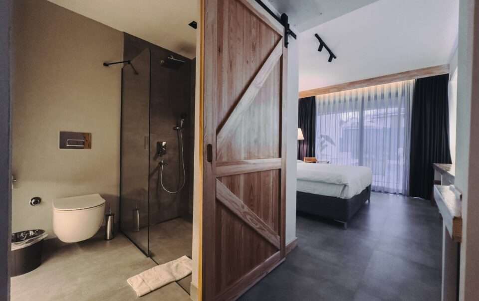 Scape Hotel bathroom view of the bedroom and the sliding door